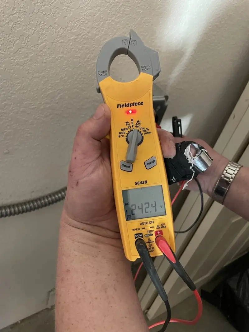 Voltage testing with clamp meter during Electrical Installation Services in Clayton